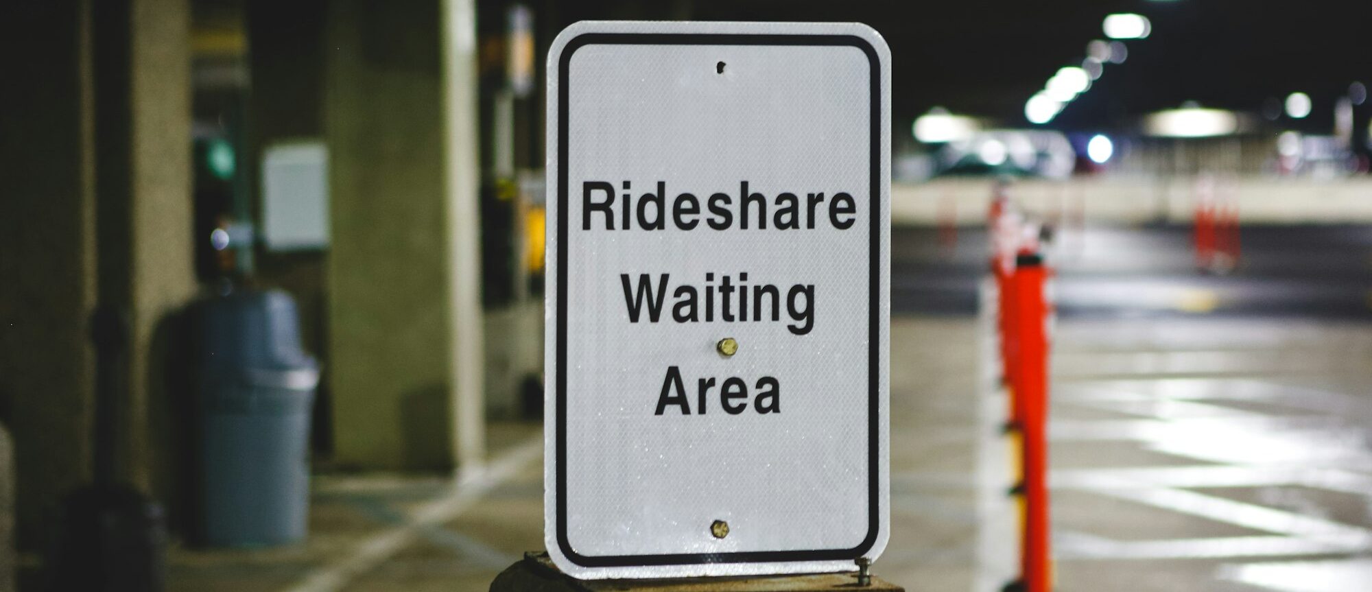 Sign that says rideshare waiting area at the airport